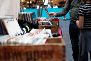 browsing music at a fair by Artificial Photography